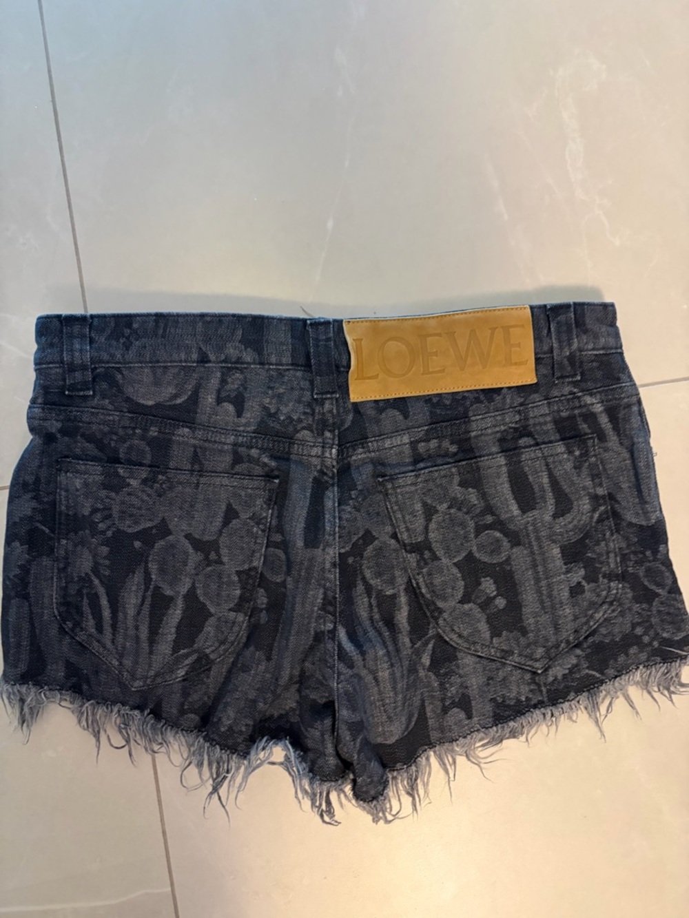 Loewe black floral jacquard denim shorts with frayed hem